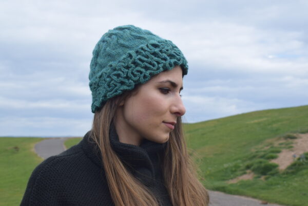 Coral Hat- Designer Evelyn Monteza presents a chic women’s hat. Coming from Peru where she has caught the world’s attention with her unique fashion designs.